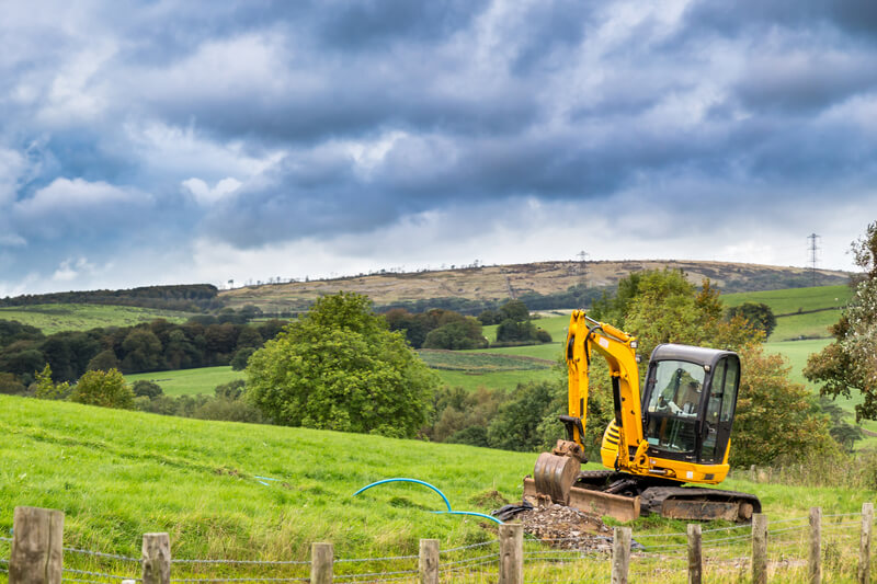 digger in a field